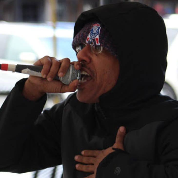 Man singing or rapping into a microphone
